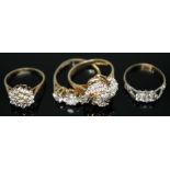 A hallmarked 9ct gold diamond cluster ring, two other hallmarked 9ct gold cluster rings, and another