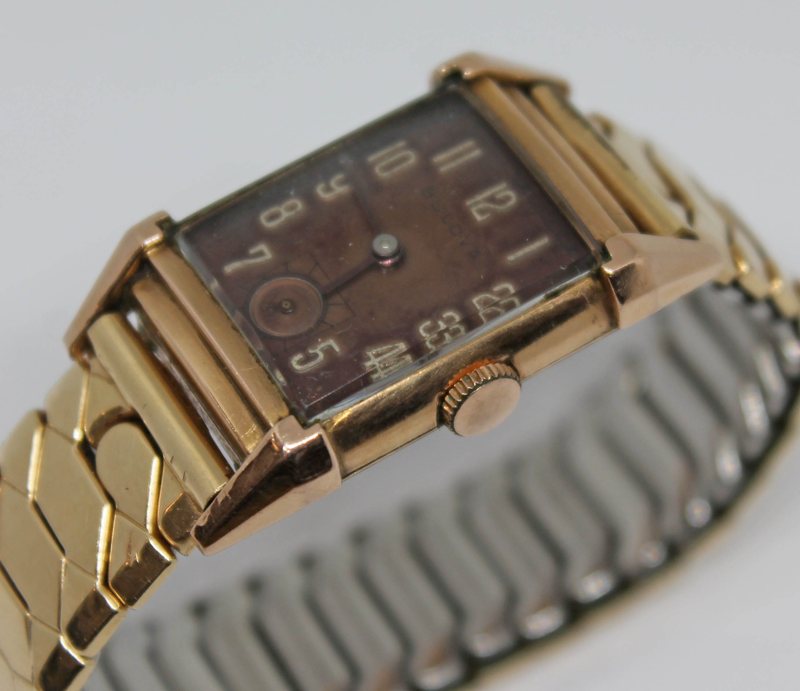 An Art Deco style Bulova 14ct gold filled wristwatch with 21 jewel manual wind movement, on gold