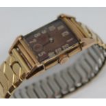 An Art Deco style Bulova 14ct gold filled wristwatch with 21 jewel manual wind movement, on gold