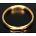 A hallmarked 22ct gold wedding band, wt. 2.64g, size N.