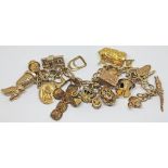 A hallmarked 9ct gold charm bracelet with 18 charms, 16 hallmarked 9ct gold, one marked '585' and