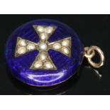 An antique blue enamel round pendant with Maltese cross to centre set with split pearls, diam. 21mm,
