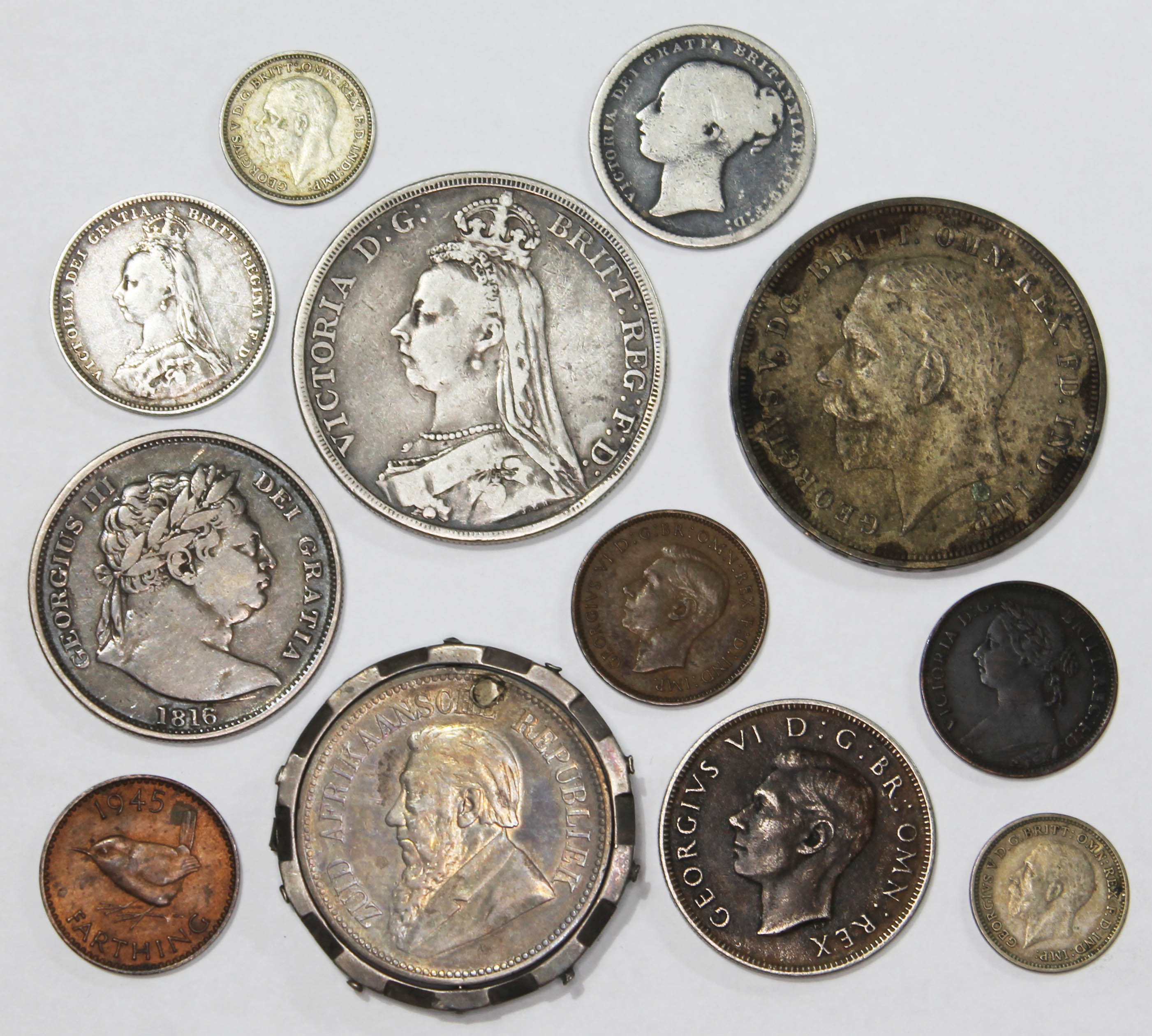 A small selection of GB coins including a Victoria 1889 crown, a George V 1935 crown, two Victoria