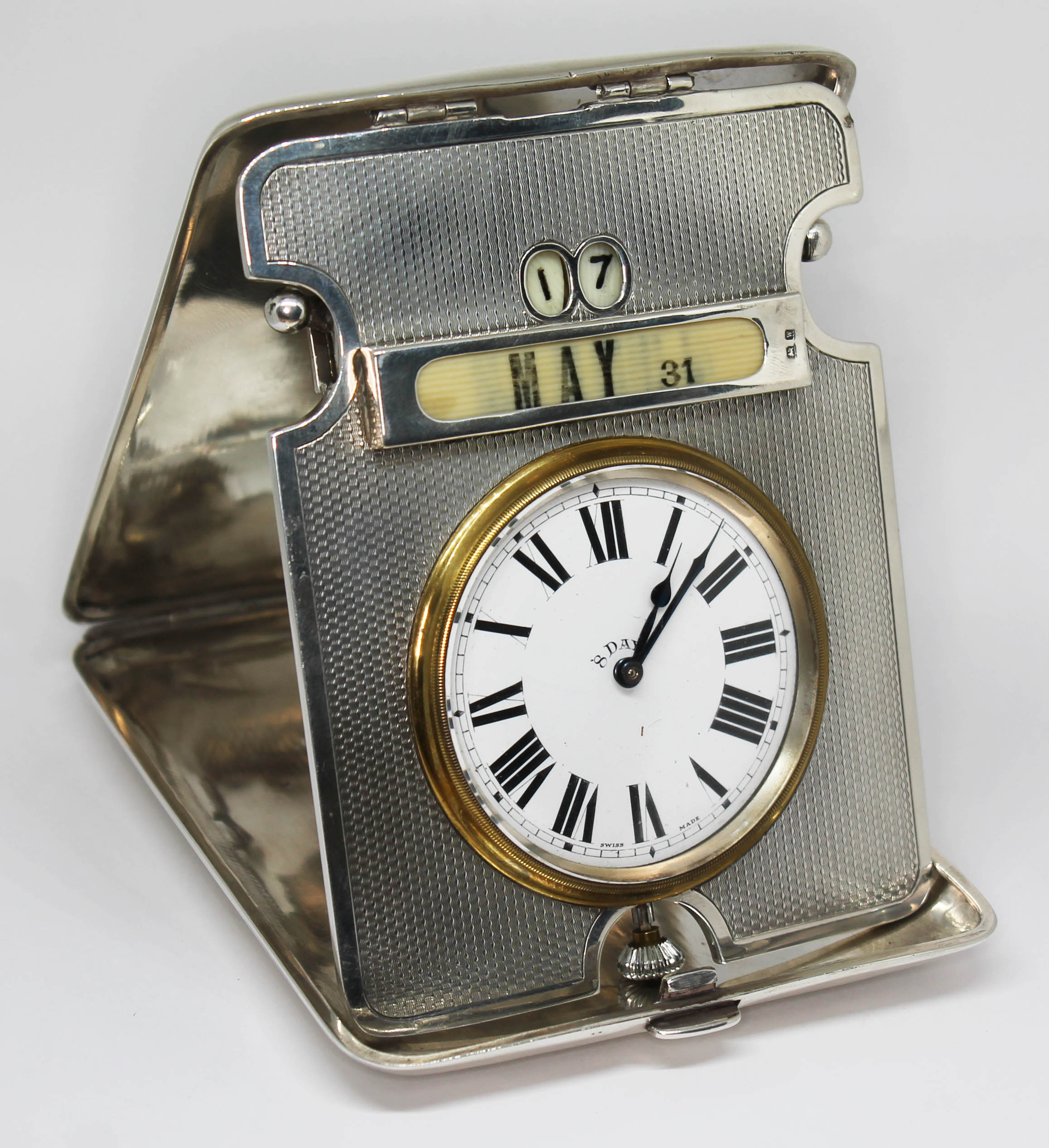 A combination desk calendar and clock in silver case, Henry Matthews, Birmingham 1921, length when