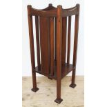 An Edwardian Arts & Crafts style mahogany plant stand with slatted sides, lower tier, on squared