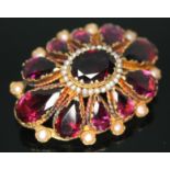 An antique garnet and pearl brooch, length 37mm, unmarked, gross wt. 8.57g. Condition - good, no