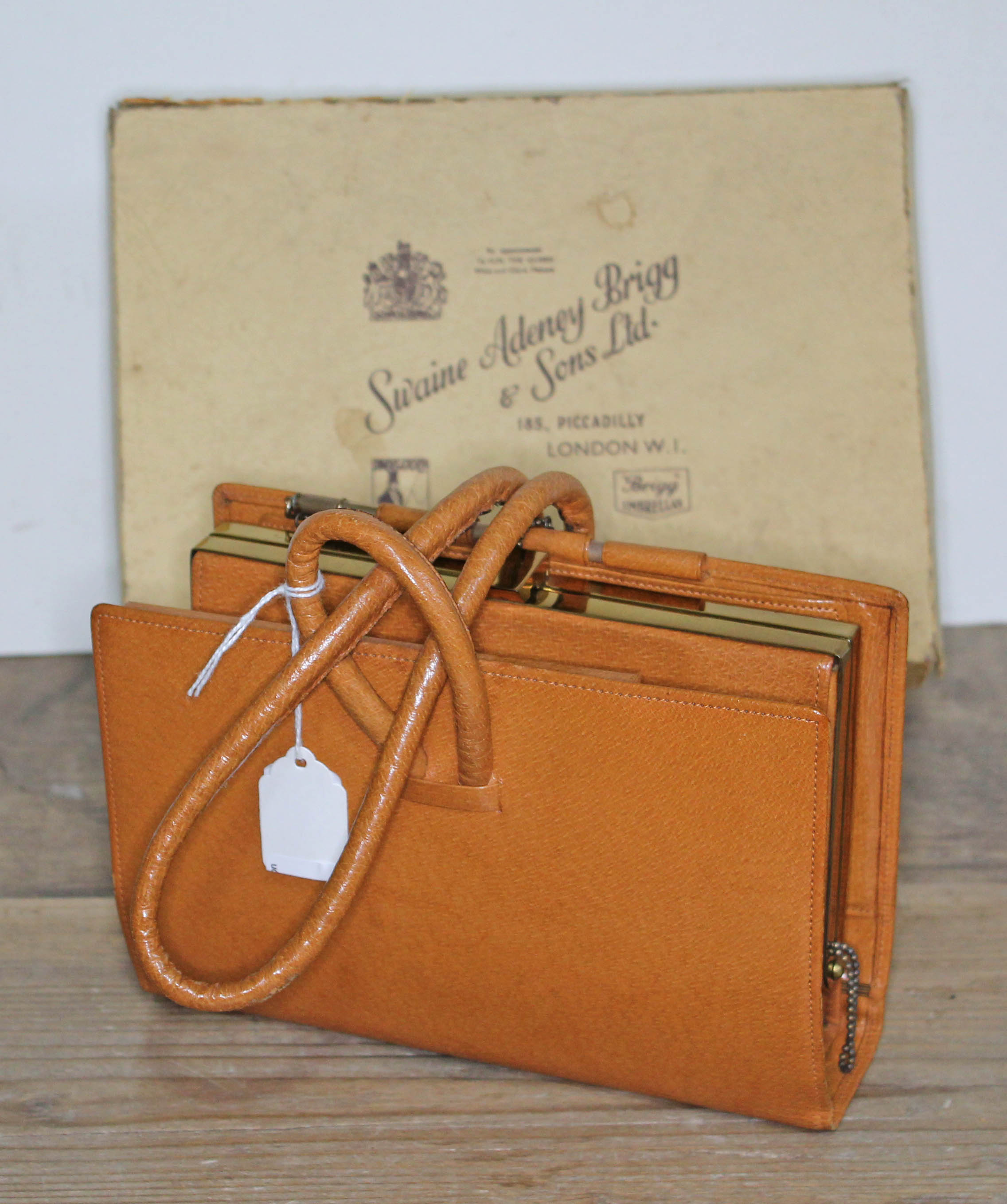 A ladies vintage leather clutch horse racing bag by Swaine, Adeney, Brigg & Sons Ltd, in original