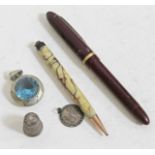 A pendant set with a blue stone marked '925', a hallmarked silver thimble and scorpio pendant marked