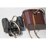 A pair of Carl Zeiss Jena Jenoptem 7x50 binoculars in leather case. Binoculars appear in very good