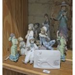 Eight Lladro pieces of various sizes, all having suffered some damage and/or repair. Lot also