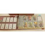 An album containing twelve sets of trade and cigarette cards.