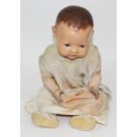 A Hugo Wiegand composition headed doll, length 58cm.