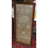 A late 19th century eastern embroidery 39cm x 99cm, glazed and framed 52cm x 112cm.