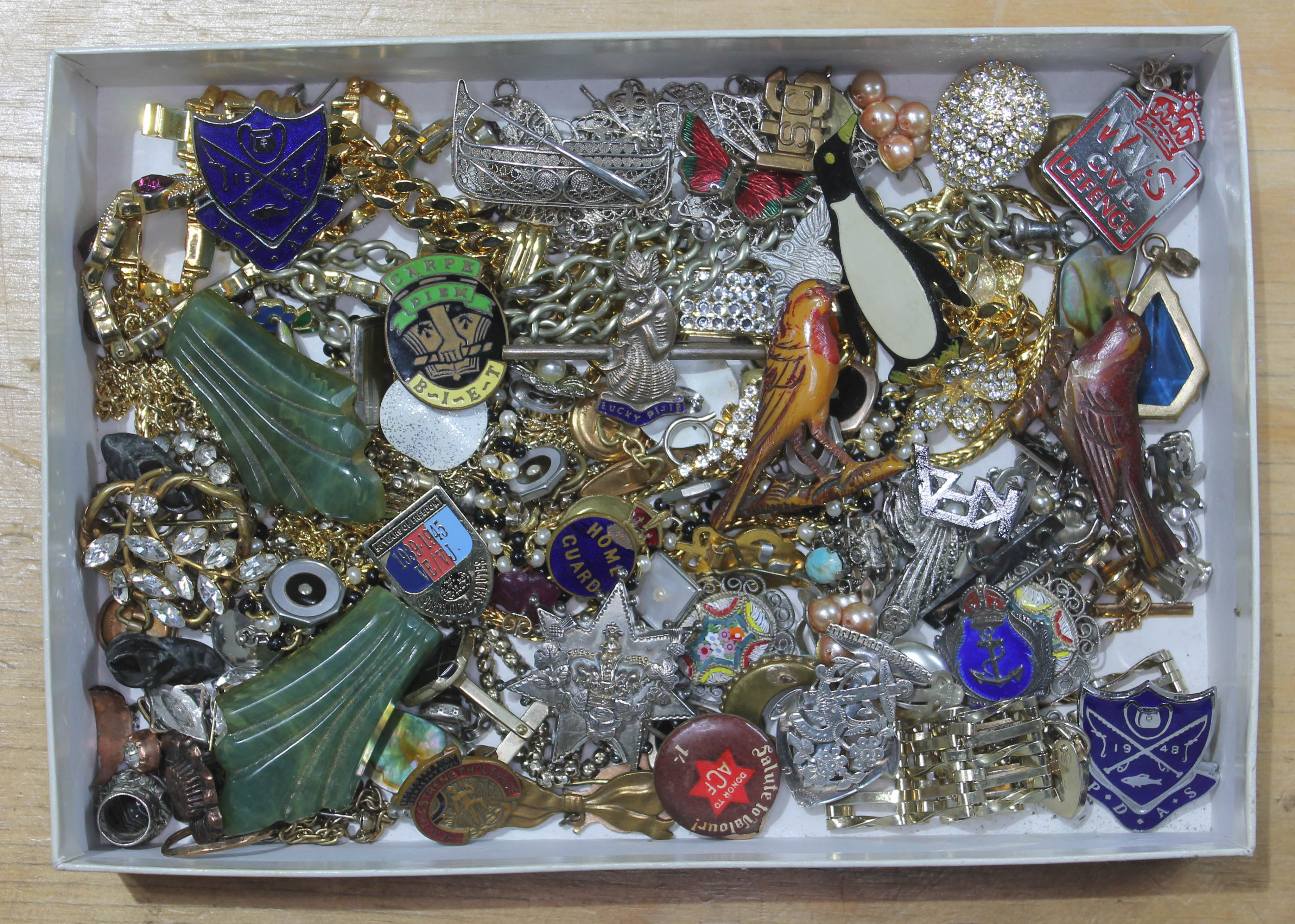 A box of costume jewellery including animal brooches, silver, micro mosaic, badges etc.