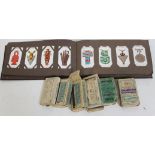 An album of cigarette cards and six cigarette boxes of various cards.