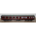 A Wayoh 0 gauge maroon dining car carriage.