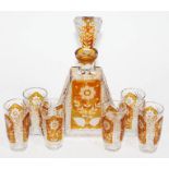 A Bohemian amber flash cut glass decanter and six liquor glasses, decanter height 26cm.