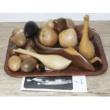 A quantity of treen wood carvings by John Fox including animals, eggs and fruit, various woods.