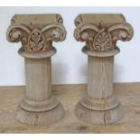 A pair of carved pine columns/capitals, height 30cm, top square (excluding scrolls) approx.