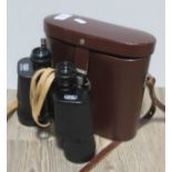 A pair of Carl Zeiss Jenoptem 10x50w binoculars in leather case No protective lens caps but