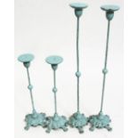 Two pairs of painted cast metal and wood hat stands, heights 36cm and 56cm.