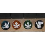 A group of four Baccarat glass paperweights "The Royal Cameos in Crystal", boxed with stands and