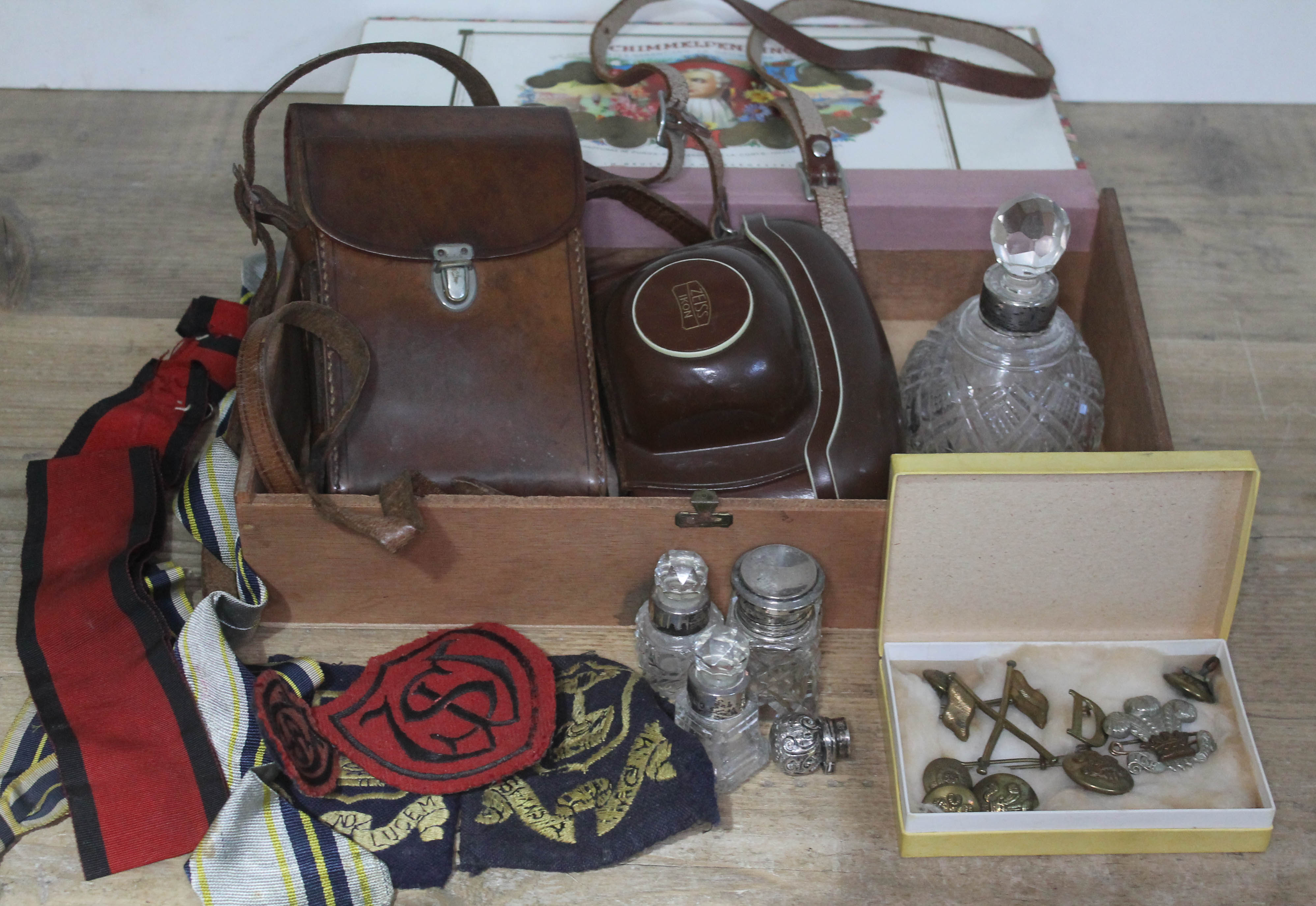 A mixed lot comprising a Zeiss Ikon and a Kodak, four hallmarked silver topped/collar bottles,