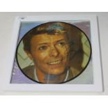 A signed, framed 12" picture disc David Bowie - Rare interview, with ticket stubs and first day