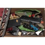 A box of Triang model railway, comprising track, trackside buildings, 2 carriages, 2 locos, and a
