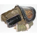 A WWII ARP issue gas mask in original tin and carry case and dated 18/01/1937 and a child's gas hood