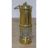 A brass miner's lamp, 'Thomas & Williams Ltd Aberdare Alderman W Healey J.P. Heywood', height (