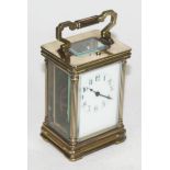 A brass carriage clock, height 15cm. Condition - not currently running.