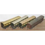 A group of four 0 gauge carriages.