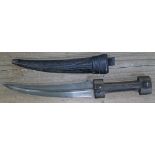 A 19th century North African Jambiya dagger, 8 1/4" slightly curved double edged damascus blade with