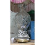 A large cut glass table lamp with brass fittings and vintage shade, height to top of bulb fitting