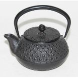 A Japanese tetsubin cast iron teapot.