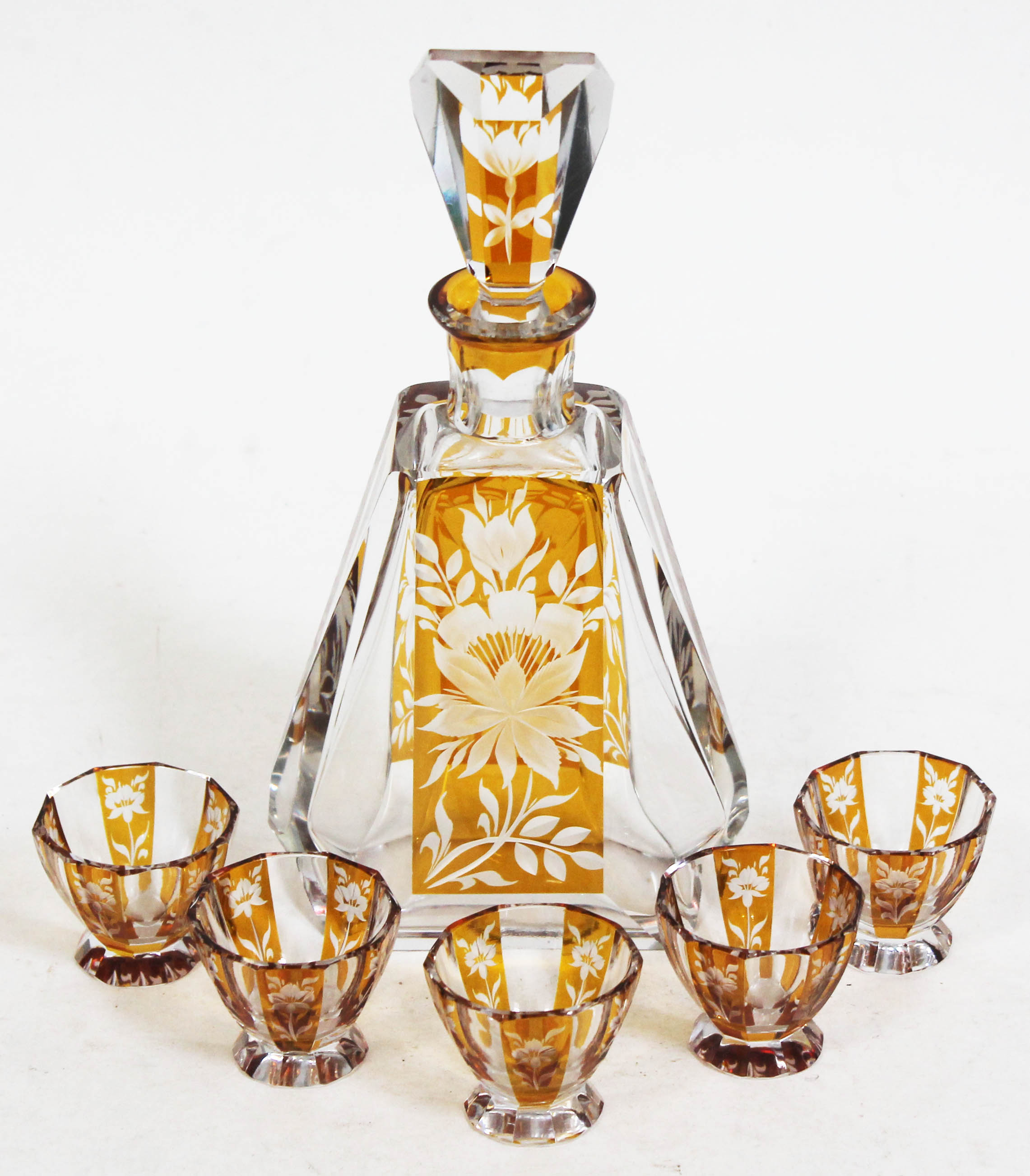 A Bohemian amber flash cut glass decanter and five liquor glasses, decanter height 27cm. Condition -