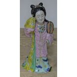 A Chinese porcelain figure, height 29.5cm.