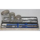 A mixed lot of hallmarked silver comprising three silver topped glass bottles/jars and twi silver