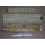 A group of four ivory rules comprising a four fold by Bradburn & Sons, a slide rule by J Tree &