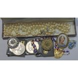 A mixed of costume jewellery, commemorative crowns, V day necklace etc.