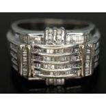 A Brutalist style white gold ring set with baguette cut diamonds, 9ct gold import marks, gross wt.