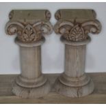 A pari of carved pine columns, height 29.5cm. Condition - one with piece broken off.