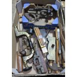 A box of mixed antique tools including wood working planes.
