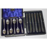 A cased set of hallmarked silver teaspoons and a cased set of hallmarked silver handle knives.