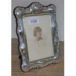 A hallmarked silver photo frame, Sheffield 1997, 21cm x 15.5cm, to fit 14x10cm photo. Condition: