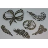 A group of six silver and white metal and pyrite/marcasite set brooches.