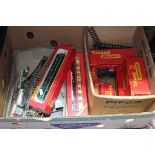 A box of Hornby/Tri-ang OO scale model railway items including loco, coaches, track, etc.