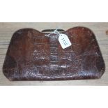 An Art Deco crocodile skin clutch bag. Condition: clasp in working condition, handle ok no damage,