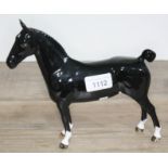 A Beswick horse, 'Black Magic', height 20cm, length 21cm. Condition: very minor nibble to tip of one
